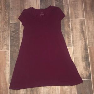 Reddish/ Maroon t-shirt dress. Has a crisscross at the chest area.